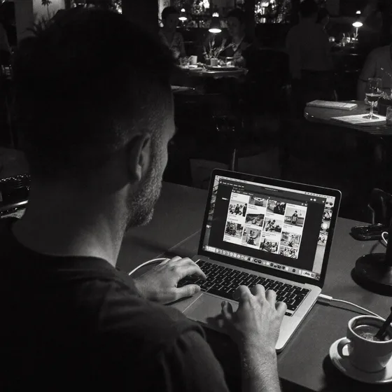 Darren Walker working on a laptop in a cafe