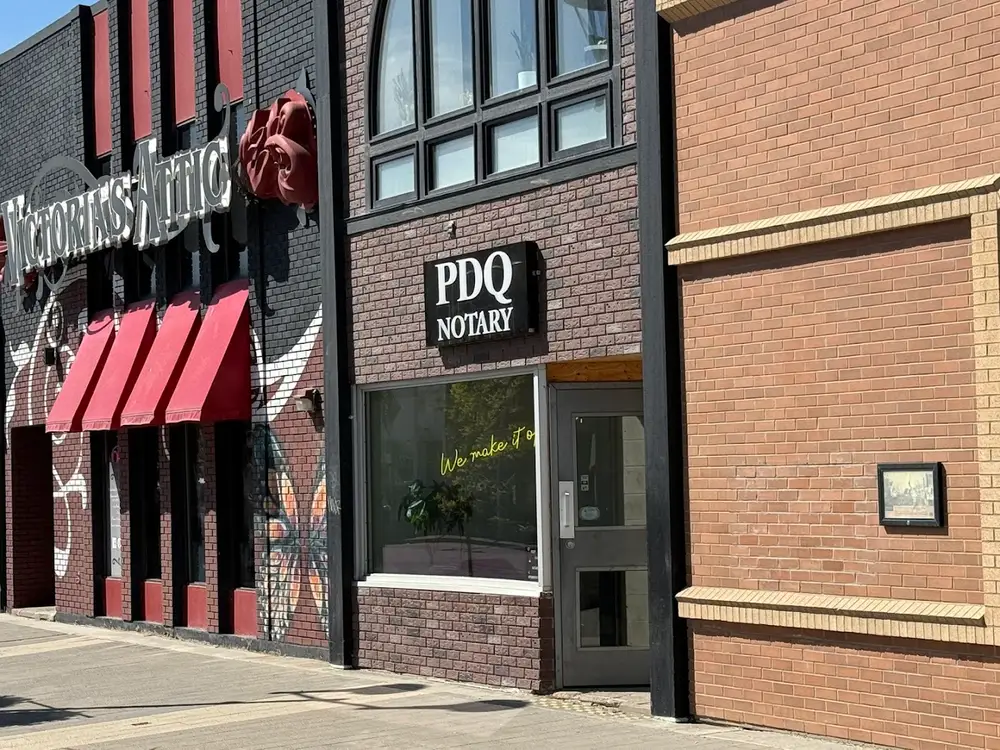 The brick front of the PDQ Notary office building