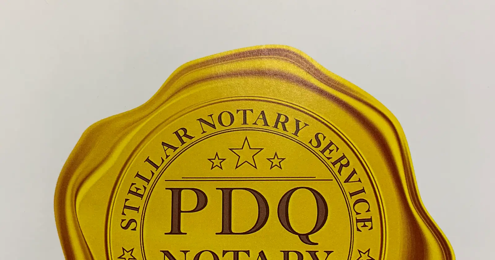 A gold wax seal reading Stellar Notary Service, PDQ Notary