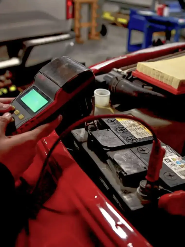 A battery test being run on a vehicle at Quick Lane North
