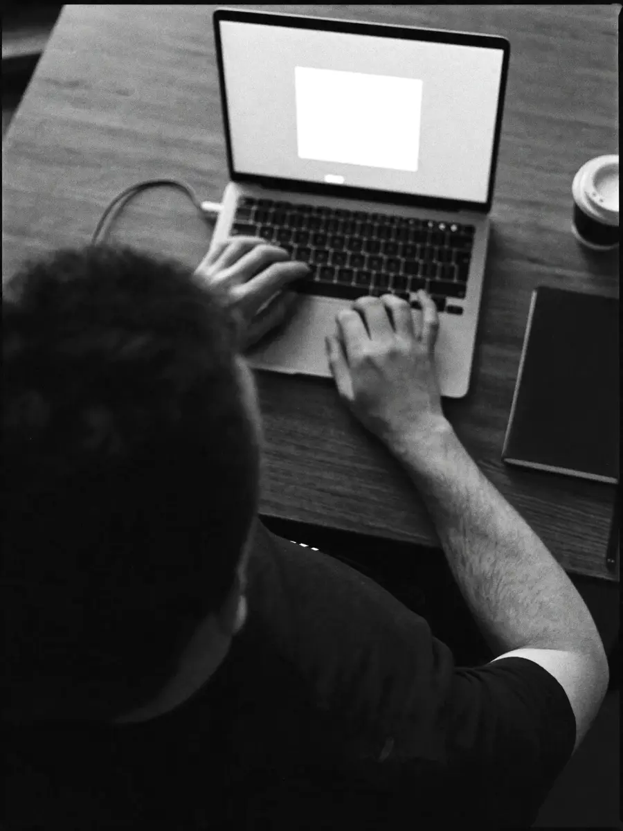 Darren Walker of Sixo Agency building a website on a laptop in Grande Prairie
