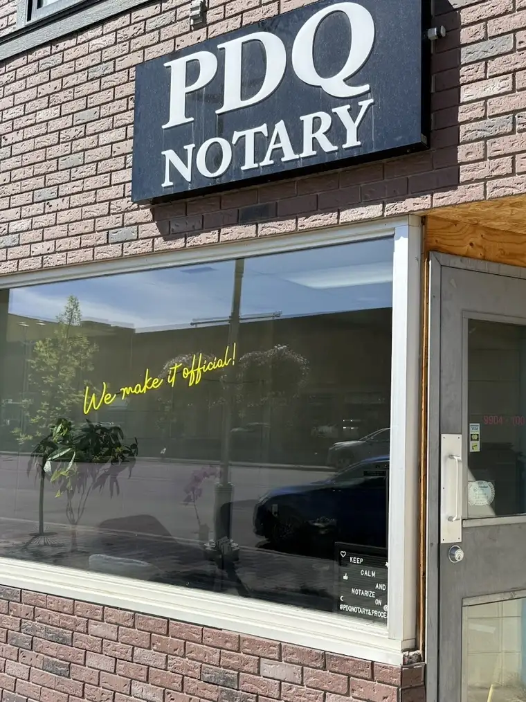 The PDQ Notary sign above the office window